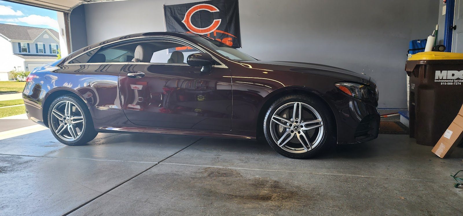 A dark Mercedes coupe detailed to a deep gloss inside Mike's home garage in Gilberts, IL